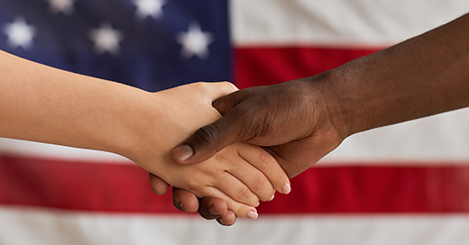 Karsun In the Community Scaling Diverse Businesses image featuring two hands shaking in front of a US flag